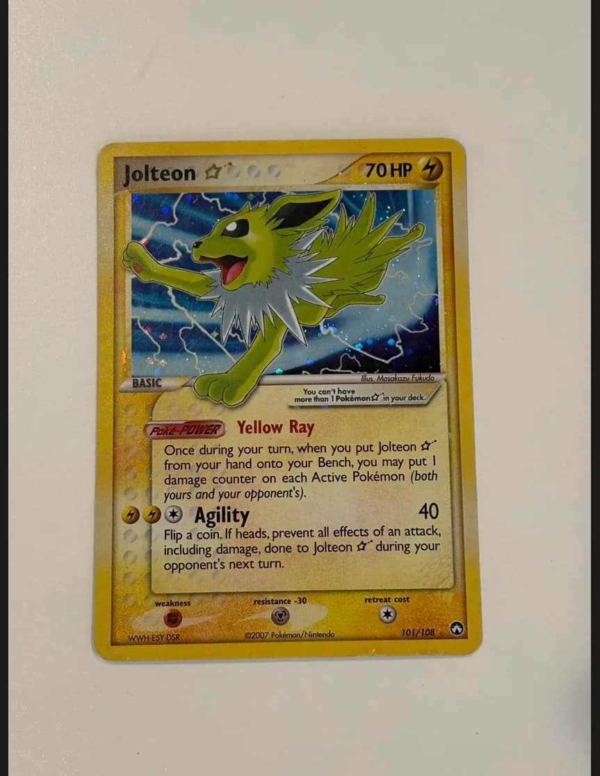 Jolteon Gold Star photographed on a white background