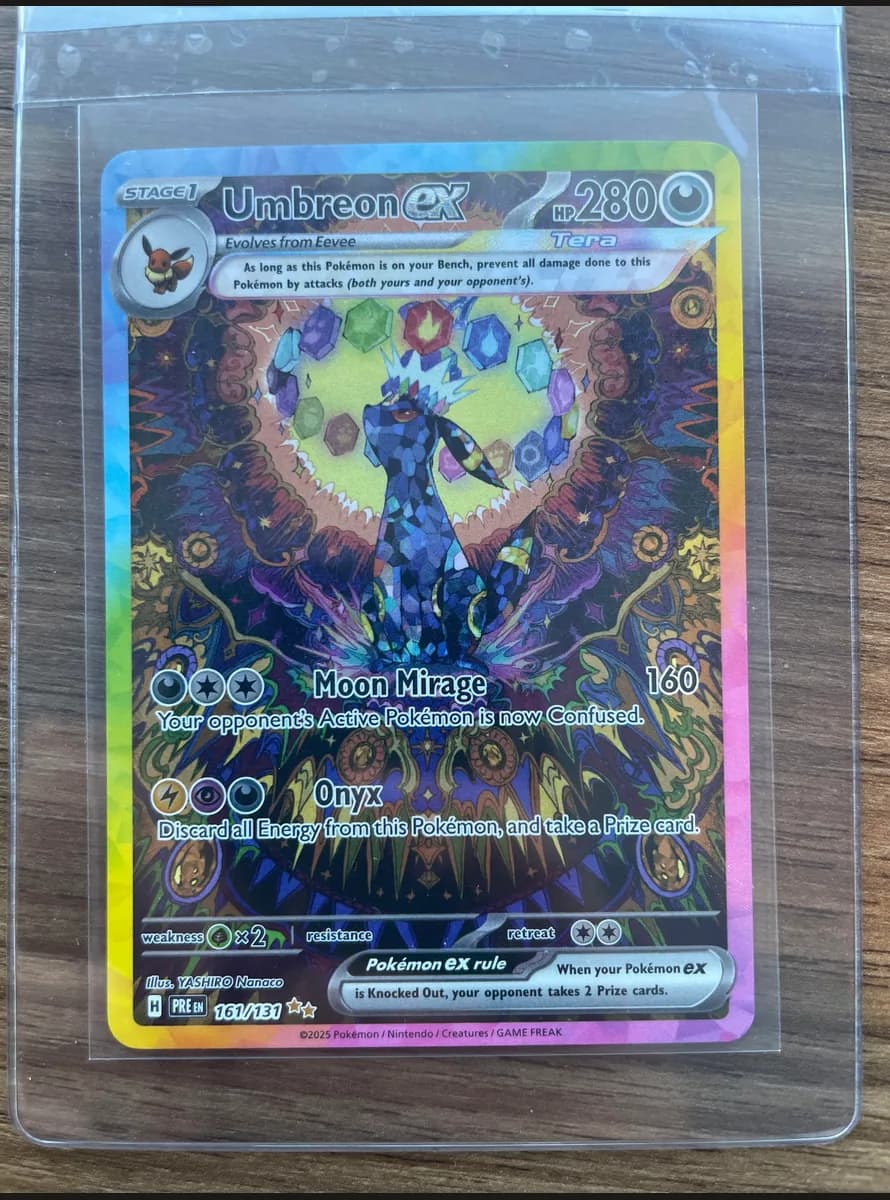 Umbreon ex (Prismatic) photographed on a penny sleeve